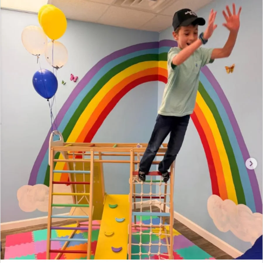 Child playing in the BrightBridge ABA Clemmons clinic during the opening celebration