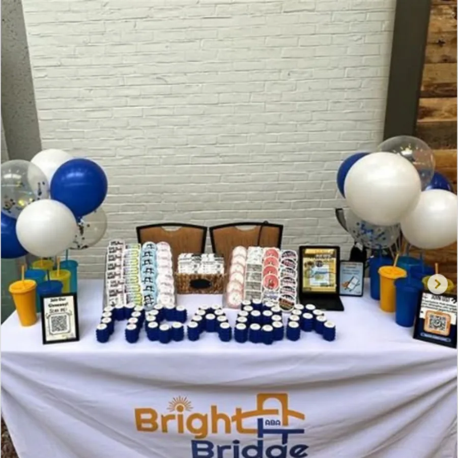 BrightBridge ABA team members at an NCABA conference booth